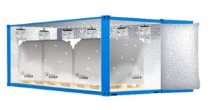 A blue shipping container with pallets covered in silver thermal blankets and insulation lining the interior walls and door, with temperature-monitoring devices hanging from the ceiling.
