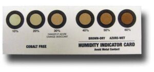 A humidity indicator card with six circles labeled 10%, 20%, 30%, 40%, 50%, and 60%. Circles change from light brown to dark brown as humidity increases. Instructions and labeling are also visible.